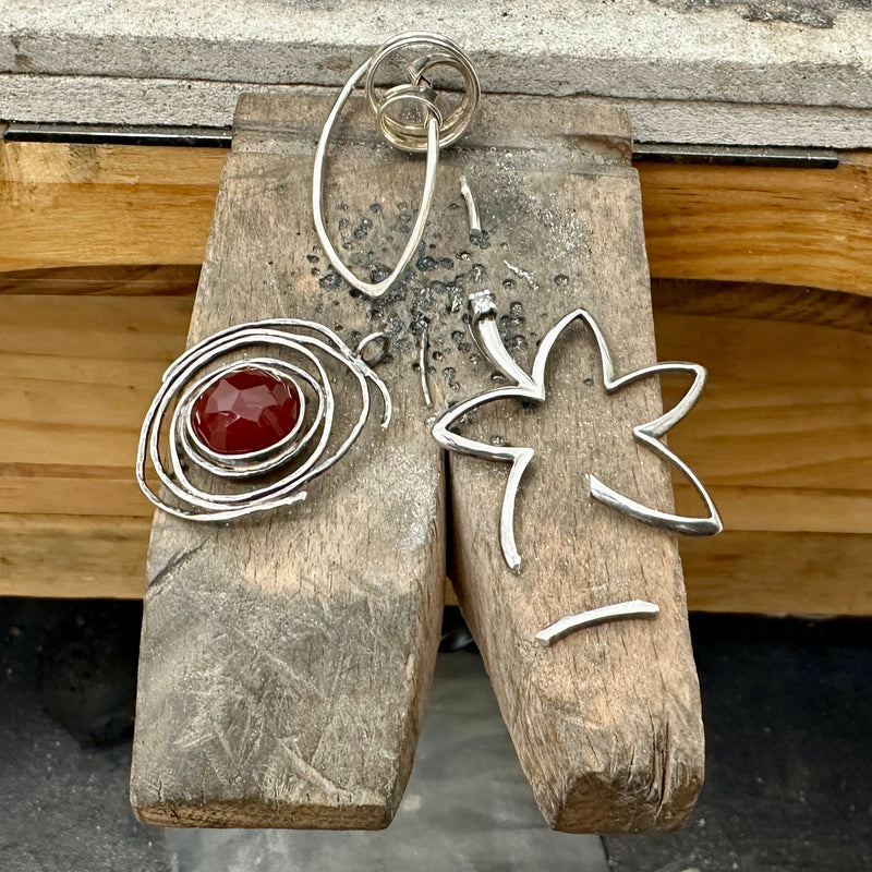 housewarming present keys with a personalised tag on a wooden table next to a cup of black coffee in a white mug, bespoke sustainable silver jewellery Nottingham