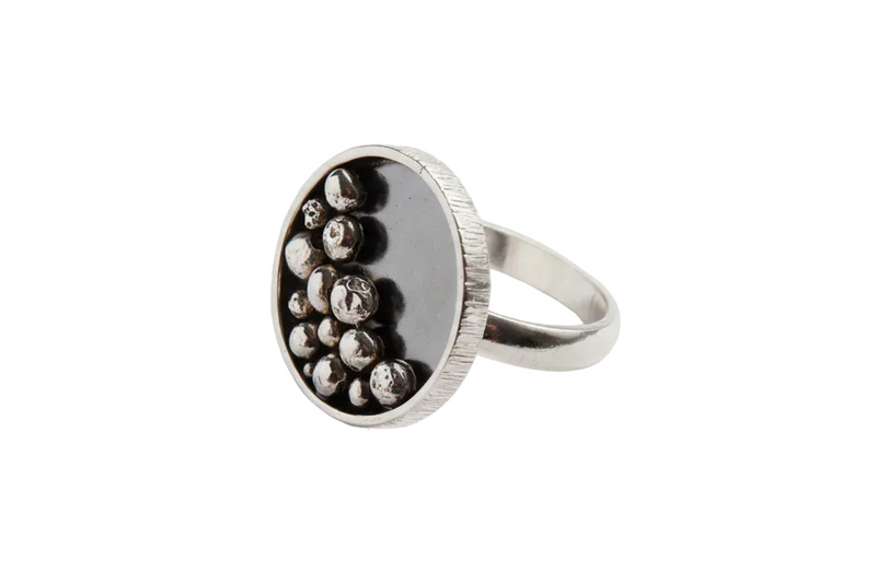 handmade sterling silver ring which is oxidised with granuels within, made by hand in Nottingham by Bottlebee