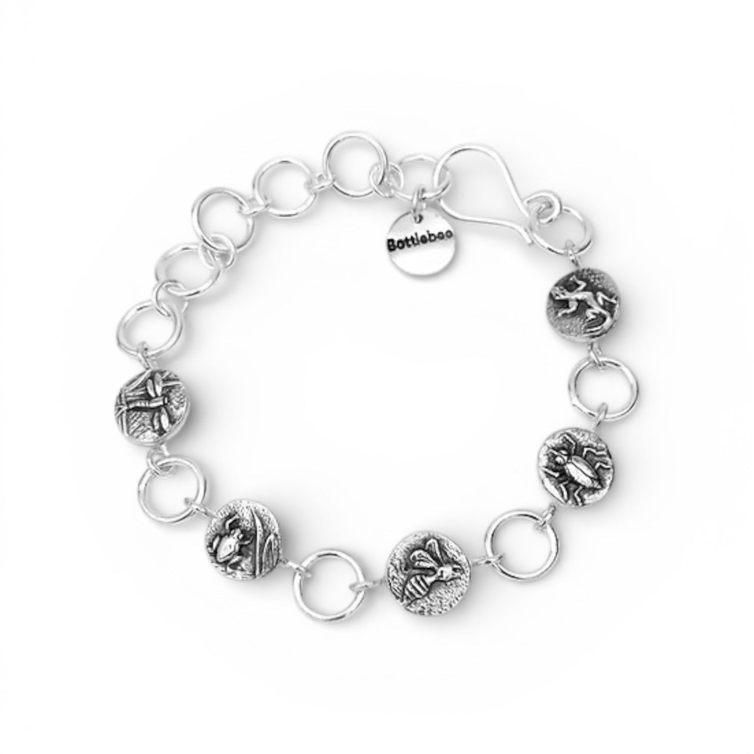 bracelet with handmade links with insect patterns in solid sterling silver. Bee dragonfly gekko beetle and frog impressions on 12mm discs separated by links and a hook clasp
