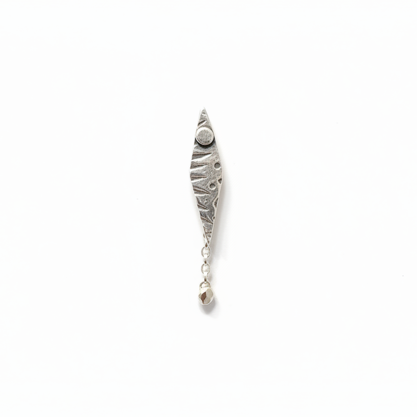 patterned single sterling silver earring in an elongated diamond shape with a round drop dangling at the bottom, made in Nottingham