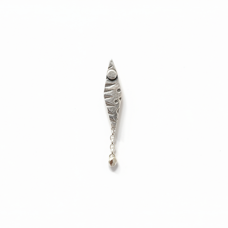 patterned single sterling silver earring in an elongated diamond shape with a round drop dangling at the bottom, made in Nottingham