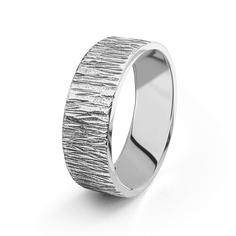 handmade sterling silver wedding ring with a bark like textured pattern made sustainable in nottingham