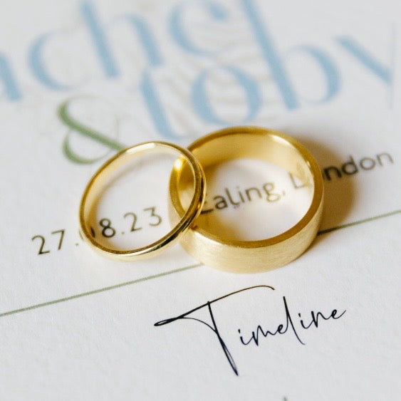 a set of gold wedding rings that have been sustainable handmade by Bottlebee in Nottingham