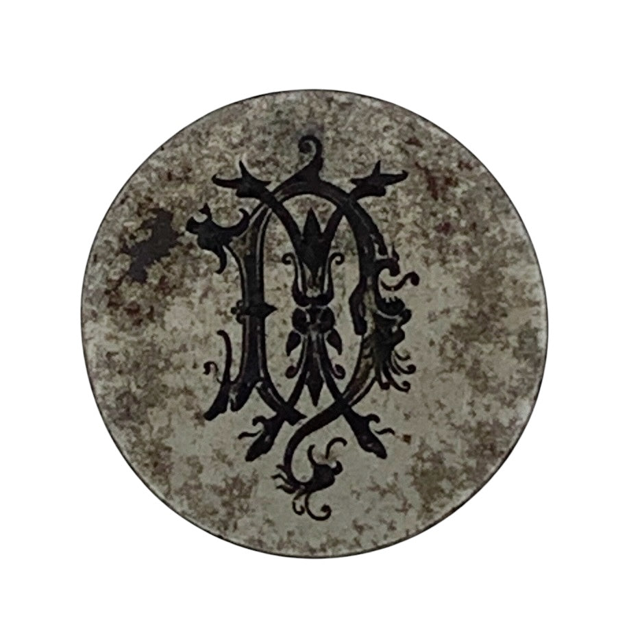 Round metal jewellery impression die with decorative black letter 'A' on a white background Nottingham jewellery