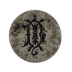 Round metal jewellery impression die with decorative black letter 'A' on a white background Nottingham jewellery