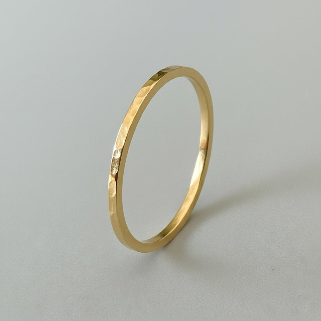 Sustainable bespoke his and hers matching solid gold wedding ring band with hammered texture handmade in Nottingham