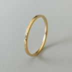 Sustainable bespoke his and hers matching solid gold wedding ring band with hammered texture handmade in Nottingham