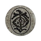 Decorative steel jewellery impression die with intricate black design on a white background