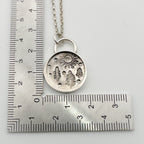 Solid silver pendant with nature-themed design on a ruler for scale handmade in Nottingham by Bottlebee sustainable
