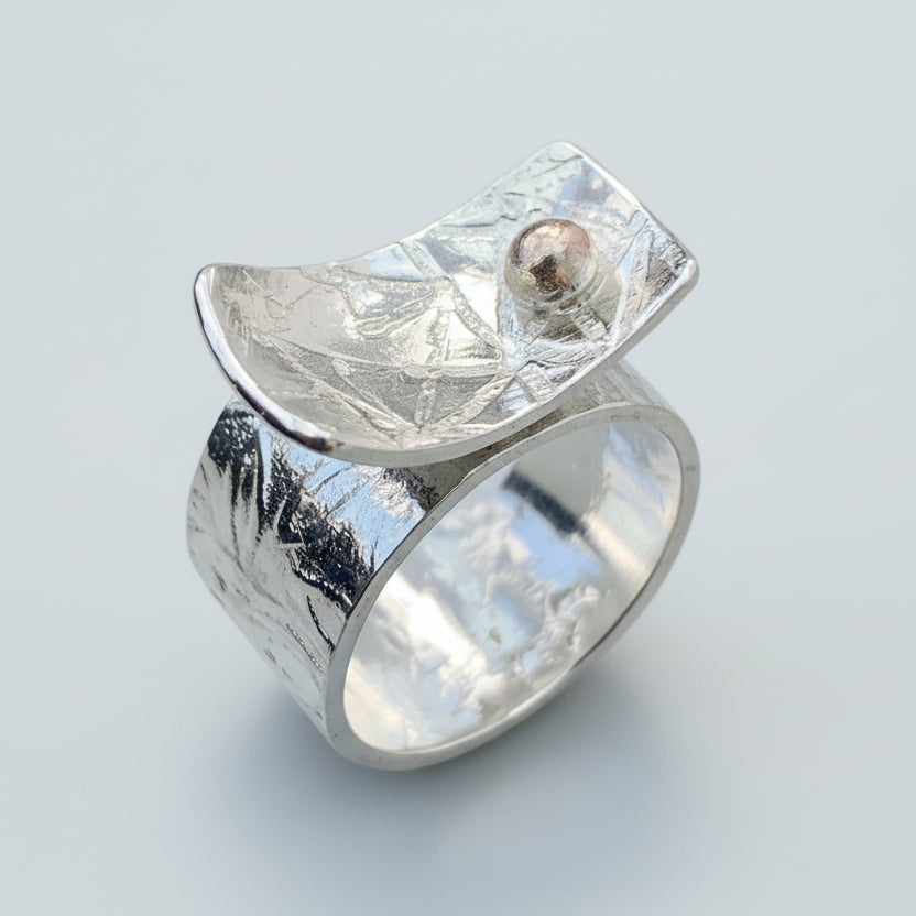 Silver ring with an 18ct ball on a light grey background handmade jewellery nottingham
