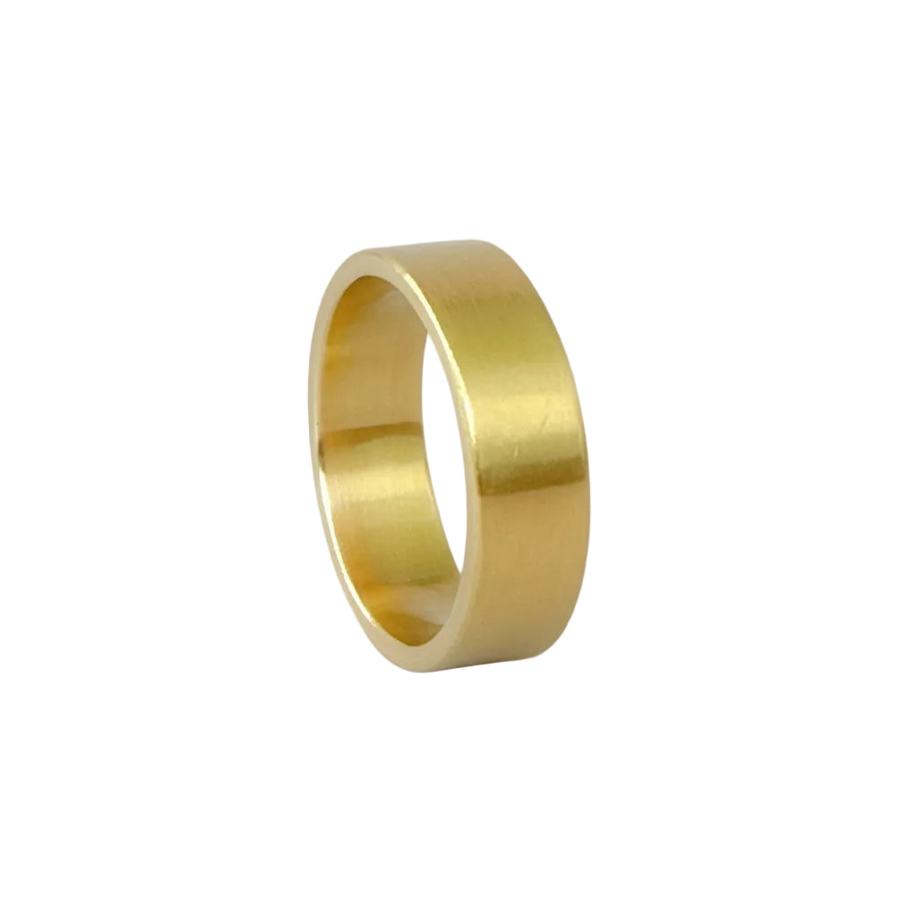 Solid gold wedding ring band with a brushed finish on a light grey background handmade in Nottingham