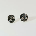 Small sterling silver round stud earrings with intricate and oxidised bee designs on a white surface handmade by Bottlebee who makes jewellery in Nottingham, commissions are welcome