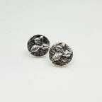 Small sterling silver round stud earrings with intricate and oxidised bee designs on a white surface handmade by Bottlebee who makes jewellery in Nottingham, commissions are welcome