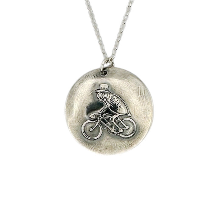 handmade sterling silver pendant with a unique flea in a top hat riding a bike hamdmade by Bottlebee  who makes sustainable bespoke jewellery in Nottingham