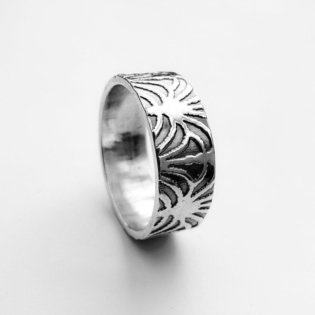 An art deco style wedding ring for man or wonam, the wedding band is handmade by Bottlebee who makes sustainable bespoke jewellery in Nottingham