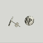 Small sterling silver round stud earrings with intricate and oxidised dragonfly designs on a white surface handmade by Bottlebee who makes jewellery in Nottingham, commissions are welcome