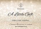 Bottlebee jewellery gift voucher with a glittery background, jewellery is handmade by a small ethnic goldsmith jeweller called Bottlebee in Nottingham sustainable gold and silver jewellery