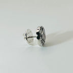 Silver personalised jewellery tie pin lapel pin shown on a finger against a white background made in Nottingham