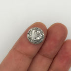 Silver personalised jewellery shown on a finger against a white background made in Nottingham