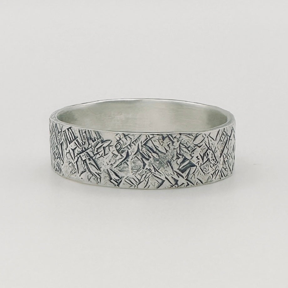 Sterling sliver unique wedding band for man or woman with a hatch lined pattern made by Bottlebee in Nottingham with sustainable 925 solid silver