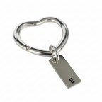 sterling silver heart keyring with a personalised hand stamped E on a 4cm rectangle tag