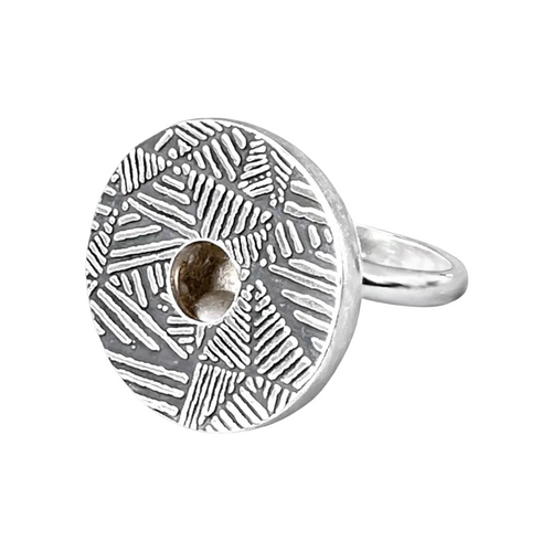 Silver kinetic ring with geometric pattern on a white background. Moving ball that makes a gently sound when moves