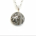 Sterling silver pendant with a detailed raised frog amphibian impression and a silver belcher necklace