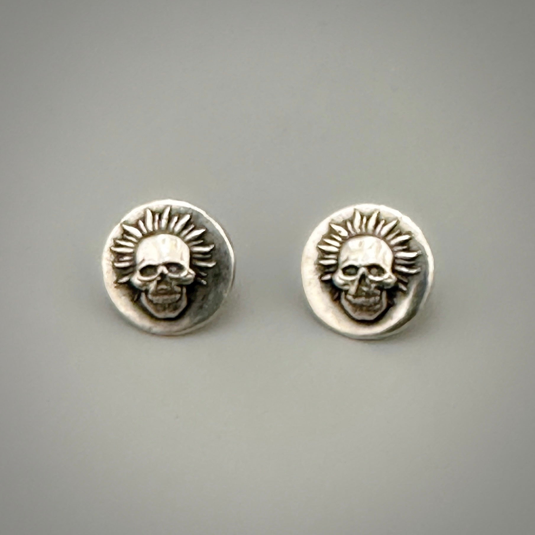 Original funky sustainable sterling silver skull earrings handmade with sustainable practices by a small business called Bottlebee in Nottingham