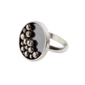 Silver bespoke handmade sterling silver ring with balls in an oxidised bezel made in Nottingham by an independent jeweller in Nottingham 