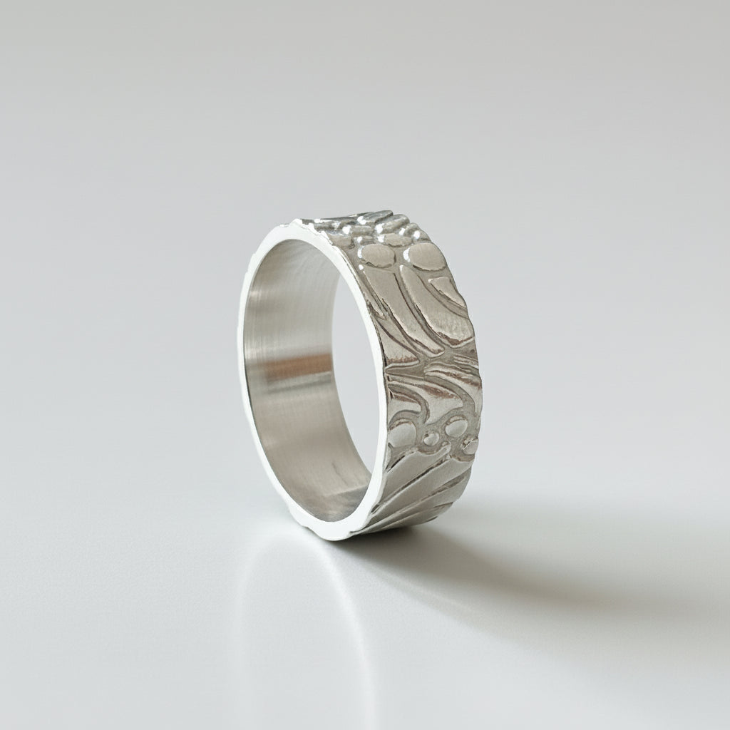 solid sterling siver wedding band jewellery with and unusual bespoke patterned design for men and woman handmade by Bottlebee in Nottingham