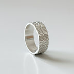 solid sterling siver wedding band jewellery with and unusual bespoke patterned design for men and woman handmade by Bottlebee in Nottingham