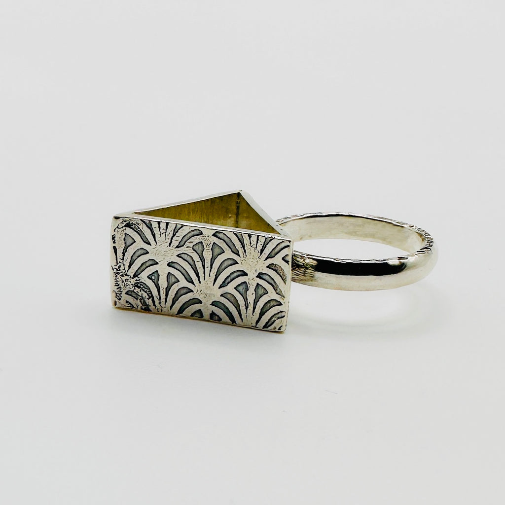 Brutalist sterling silver alternative ring with a pattern on each side, handmade sustainable by Bottlebee in Nottingham who makes bespoke jewellery