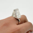 Sterling silver alternative brutalist rig with a pattern on each side, handmade sustainable by Bottlebee in Nottingham who makes bespoke jewellery