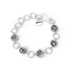 Solid silver bracelet with various insect charms handmade by Bottlebee in Nottingha on a white background 