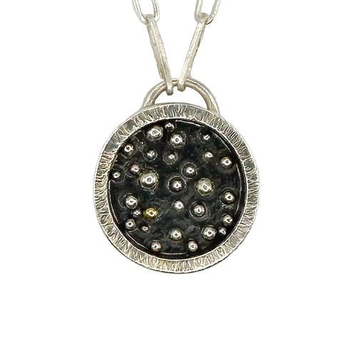 close up of silver and gold pendant with a paperclip chain made with sustainable practices in Nottingham by Bottlebee