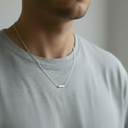 man in a grey tshirt wearing a handmade sterling silver necklace made by a small one woman business in Wollaton Nottingham