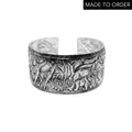 Silver elephant and giraffe jewellery embossed bracelet on a white background with 'Made to Order' text. Unusual handmade jewellery by Bottlebee in Nottingham