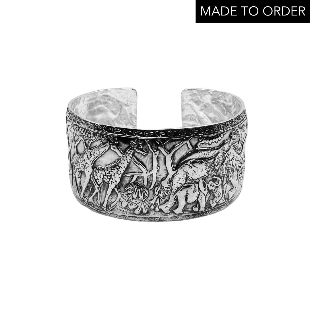 Silver elephant and giraffe jewellery embossed bracelet on a white background with 'Made to Order' text. Unusual handmade jewellery by Bottlebee in Nottingham