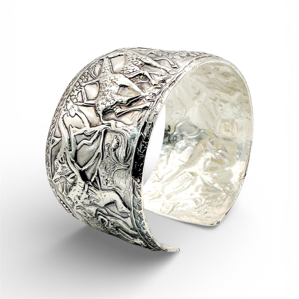 Sterling silver handmade cuff with intricate elephants and giraffes with flora and fauna made in sustainable by Bottlebee in Nottingham