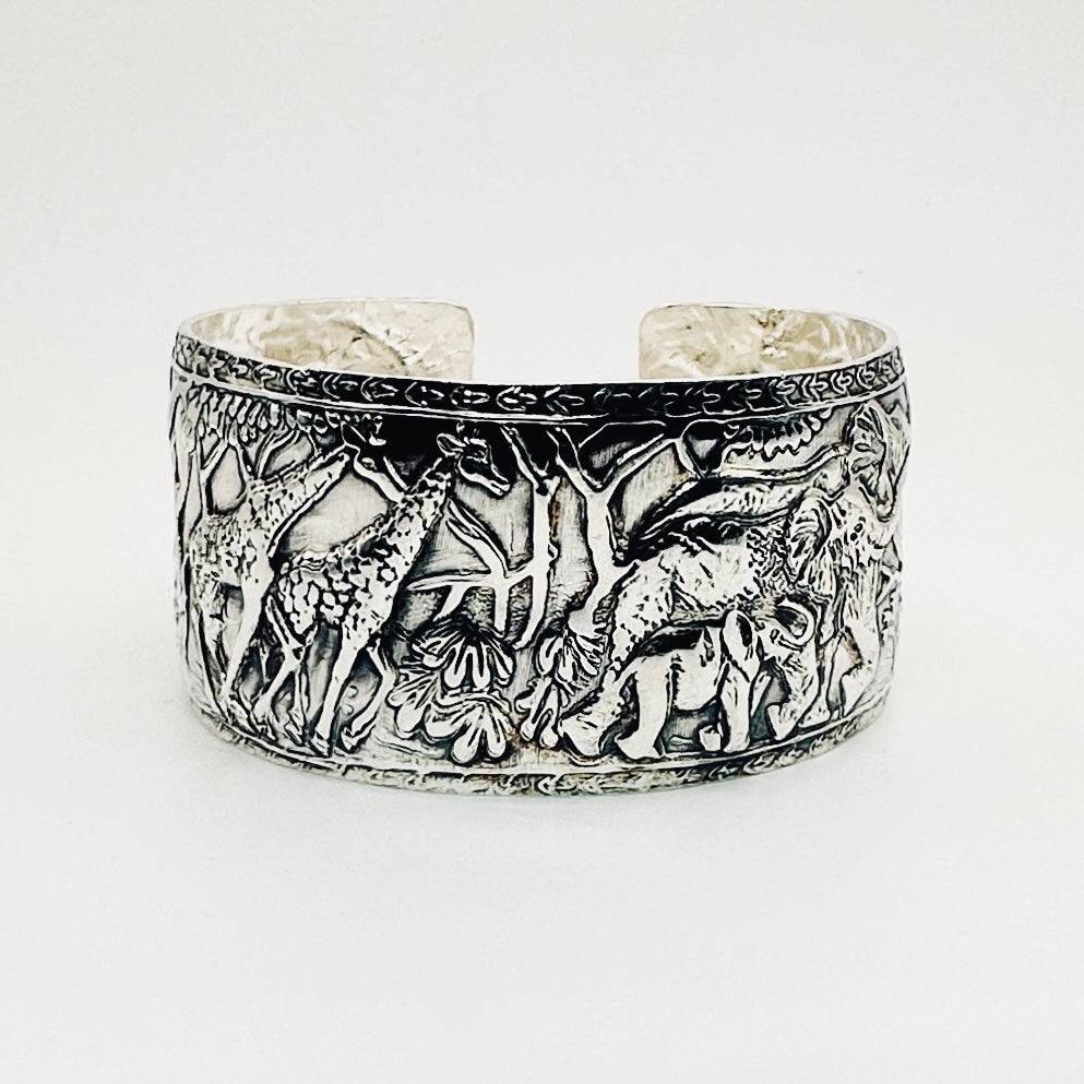 Sterling 925 silver handmade cuff with intricate elephants and giraffes with flora and fauna made in sustainable by Bottlebee in Nottingham