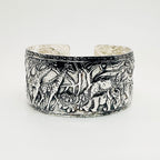 Sterling 925 silver handmade cuff with intricate elephants and giraffes with flora and fauna made in sustainable by Bottlebee in Nottingham