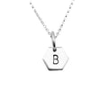 Silver necklace with a hexagonal pendant featuring a hand stamped letter 'B' on a light gray background made by Bottlebee in Nottingham
