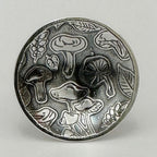 close up of silver mushroom statement ring showing different mushrooms and leaves handmade by small business nottingham