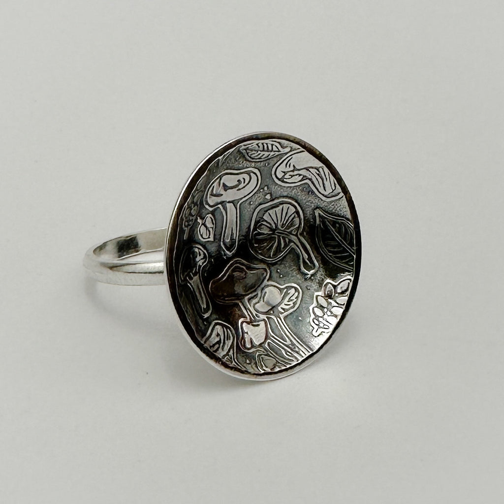 Handmade sustainable silver mushroom pattern jewellery ring made in Nottingham by a small indipendant business called Bottlebee