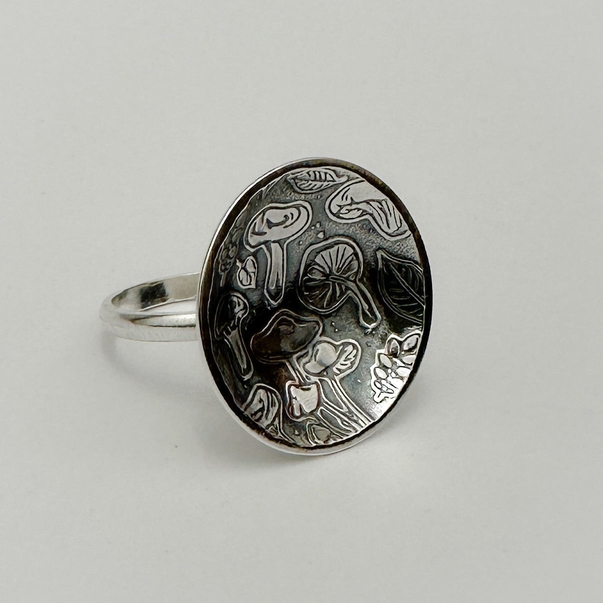 Handmade sustainable silver mushroom pattern jewellery ring made in Nottingham by a small indipendant business called Bottlebee