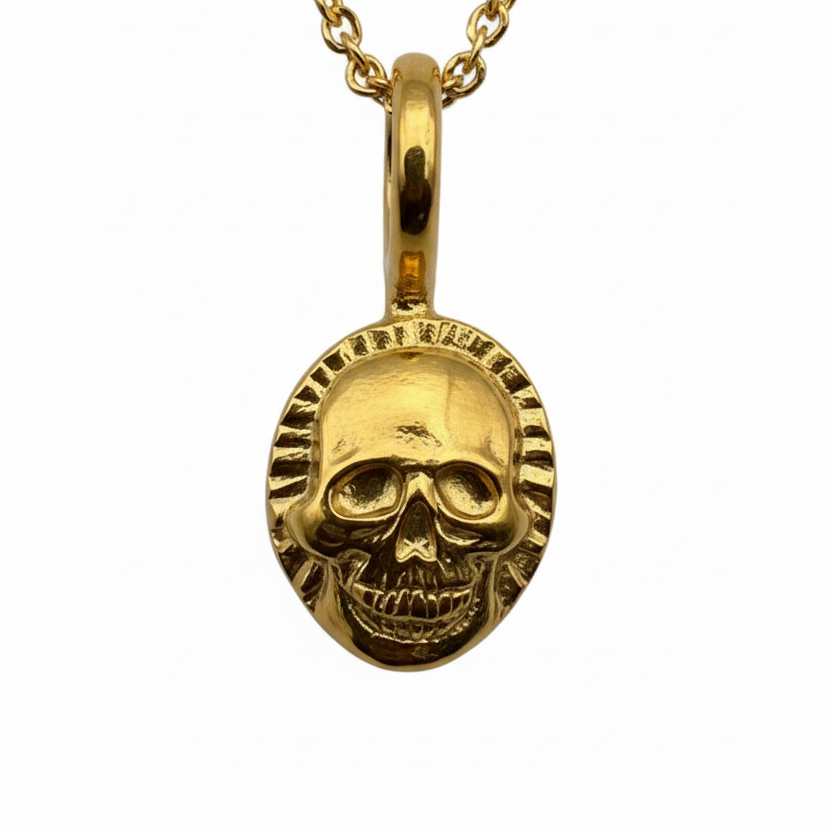 sustainable gold skull pendant necklace on a white background handmade by Bottlebee in Nottingham