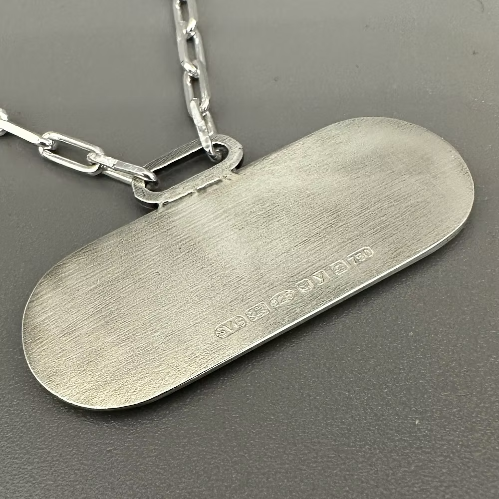 Reverse of the Stradius silver pendant with a paperclip chain showing the hallmark