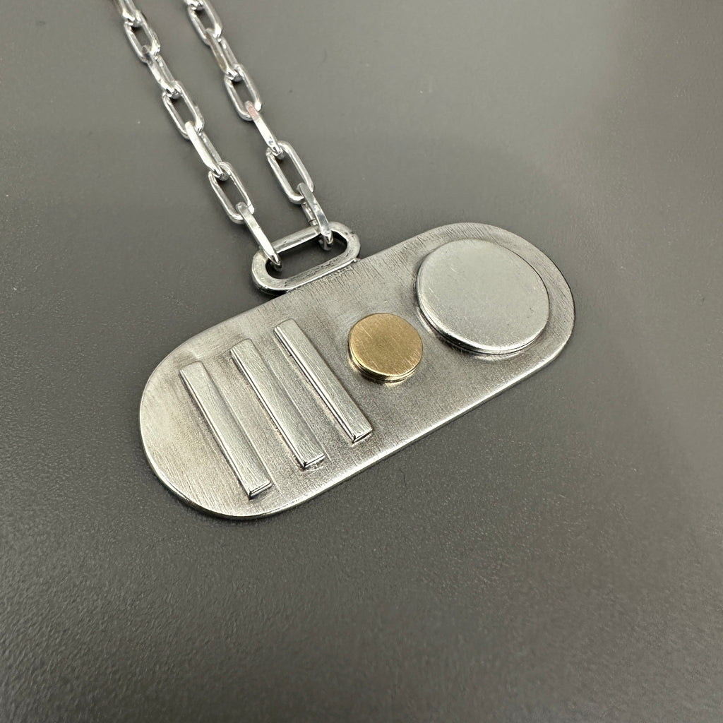 silver paperclip chain necklace with silver and gold geometric pendant sustainable handmade in nottingham by bottlebee