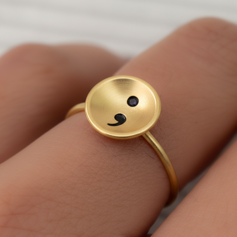 solid gold semi colon domestic violence ring handmade in nottingham by Bottlebee