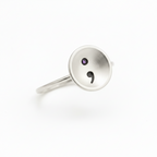 Solid sterling silver ring with a semi colon design on a white background, handmade jewellery Nottingham